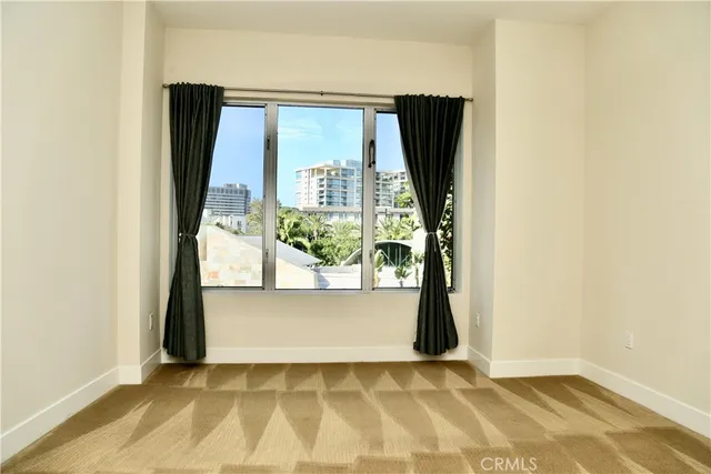 an empty room with large window