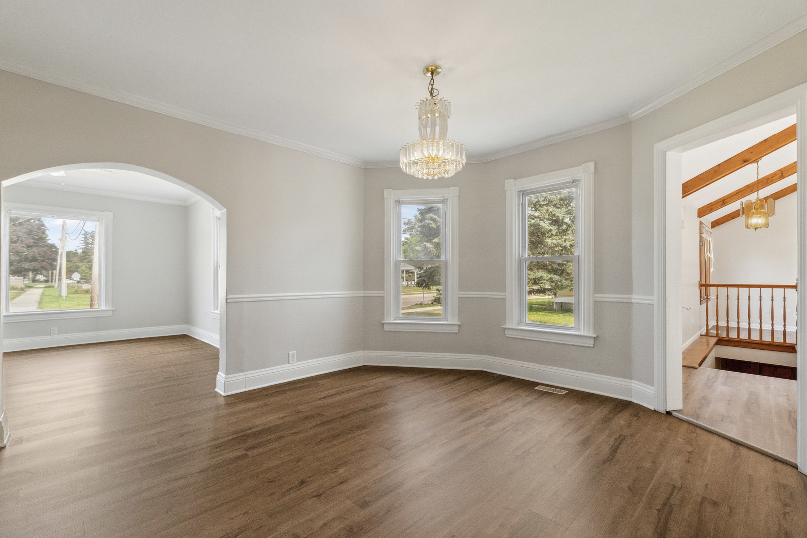 129 South Prairie Street Batavia, IL 60510 - Photo 11 of 45 an empty room with wooden floor and windows
