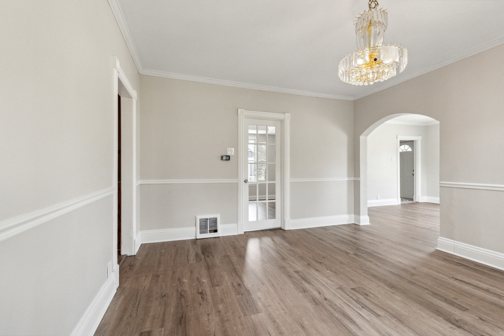 129 South Prairie Street Batavia, IL 60510 - Photo 12 of 45 a view of a room with wooden floor and window