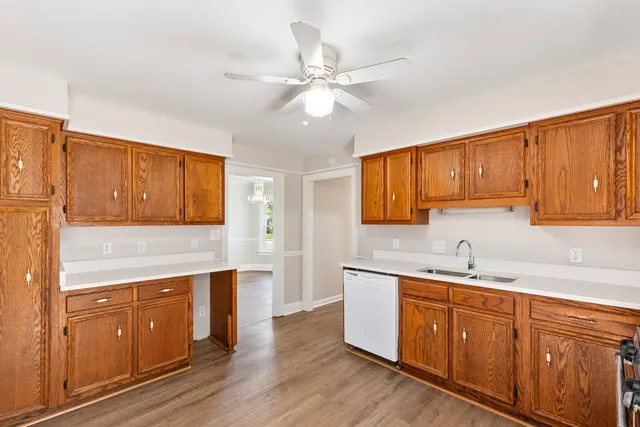 a kitchen with a sink cabinets and window