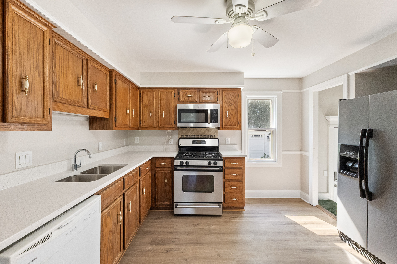 129 South Prairie Street Batavia, IL 60510 - Photo 16 of 45 a kitchen with stainless steel appliances a stove a sink and a refrigerator
