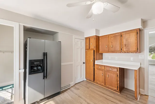 a view of walk in closet with wooden floor