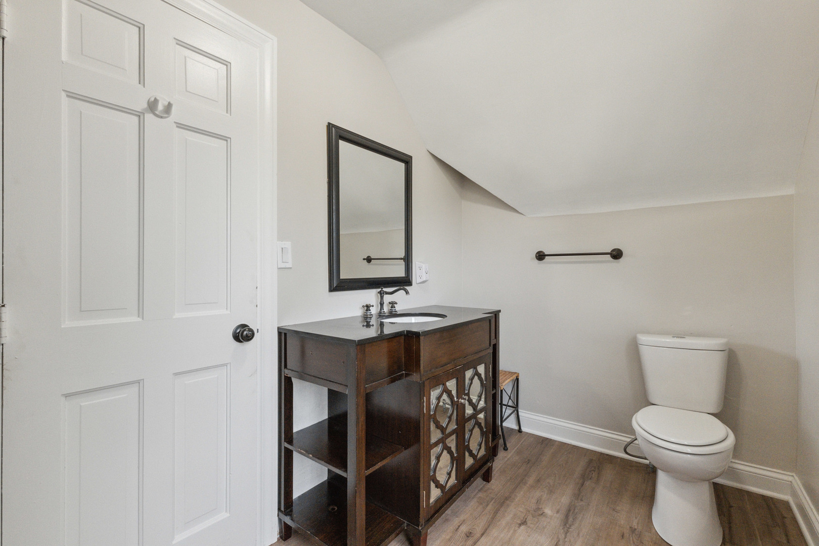 129 South Prairie Street Batavia, IL 60510 - Photo 21 of 45 a bathroom with a toilet a sink and mirror