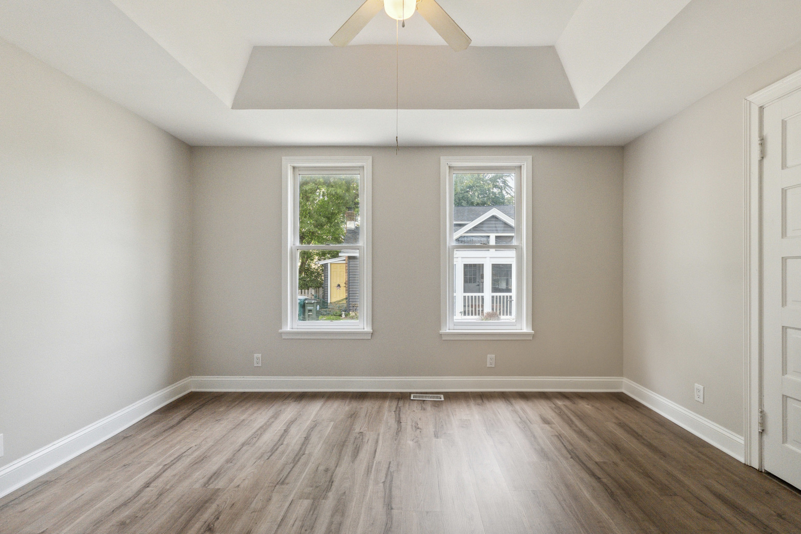 129 South Prairie Street Batavia, IL 60510 - Photo 30 of 45 an empty room with wooden floor and windows