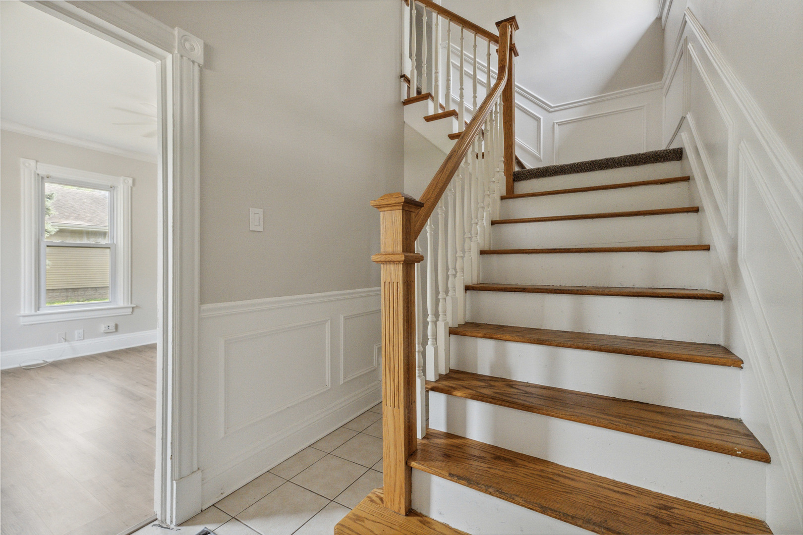 129 South Prairie Street Batavia, IL 60510 - Photo 3 of 45 a view of entryway with wooden floor and stairs