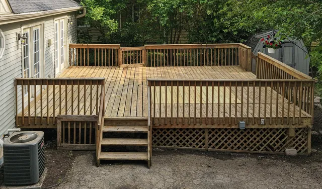 a view of barbeque area with wooden deck