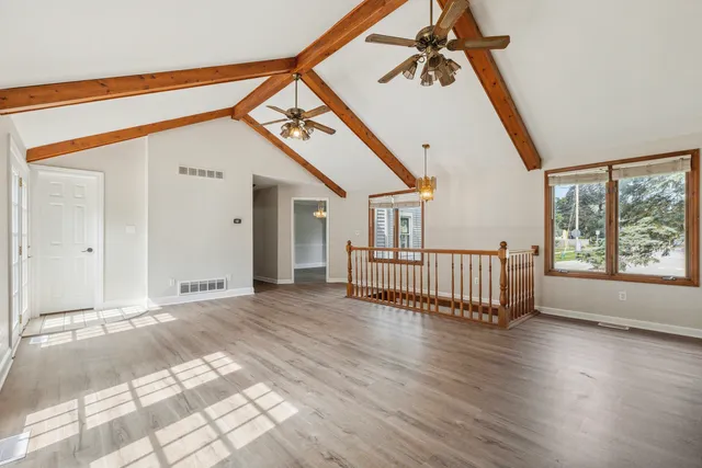 a view of entryway with stairs and wooden floor