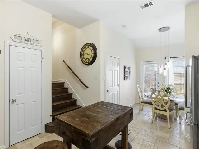 a spacious en suite bathroom with a double sink and mirror