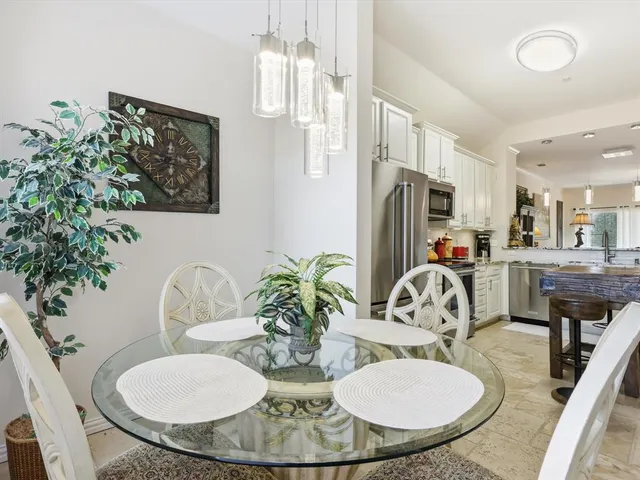 a bathroom with a double vanity sink mirror and toilet