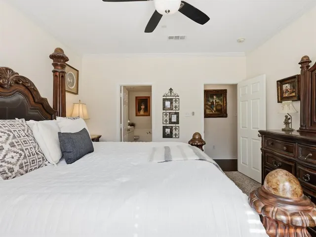 a bedroom with a bed and a large dresser