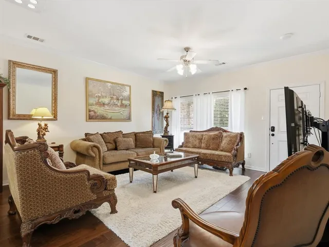 a kitchen with a sink a stove a refrigerator and white cabinets