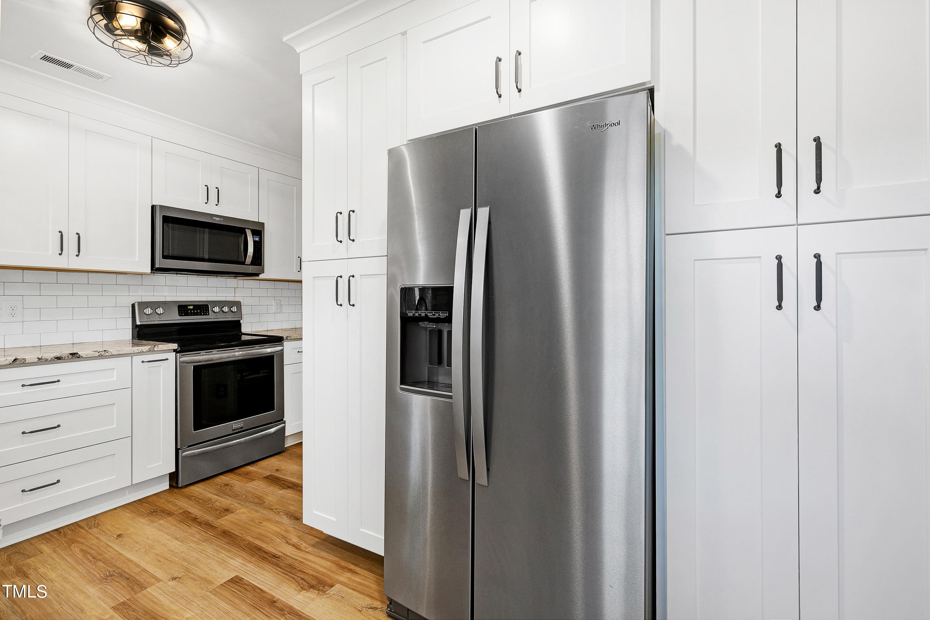 2721 Fernhurst Lane Raleigh, NC 27604 - Photo 9 of 18 Yes, the brand new stainless steel refrigerator stays with the home.
