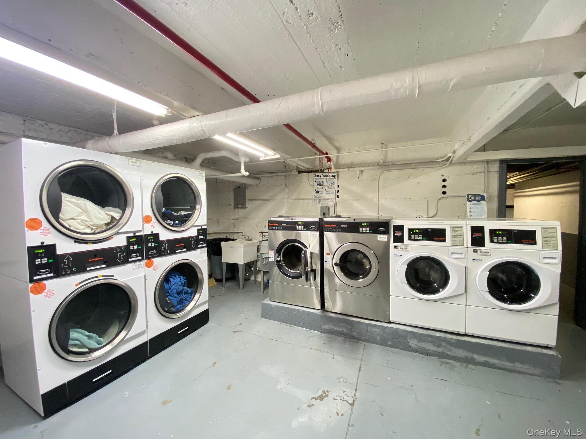 79-15 35th Avenue, Unit 3C Queens, NY 11372 - Photo 13 of 13 Community laundry with washer and dryer