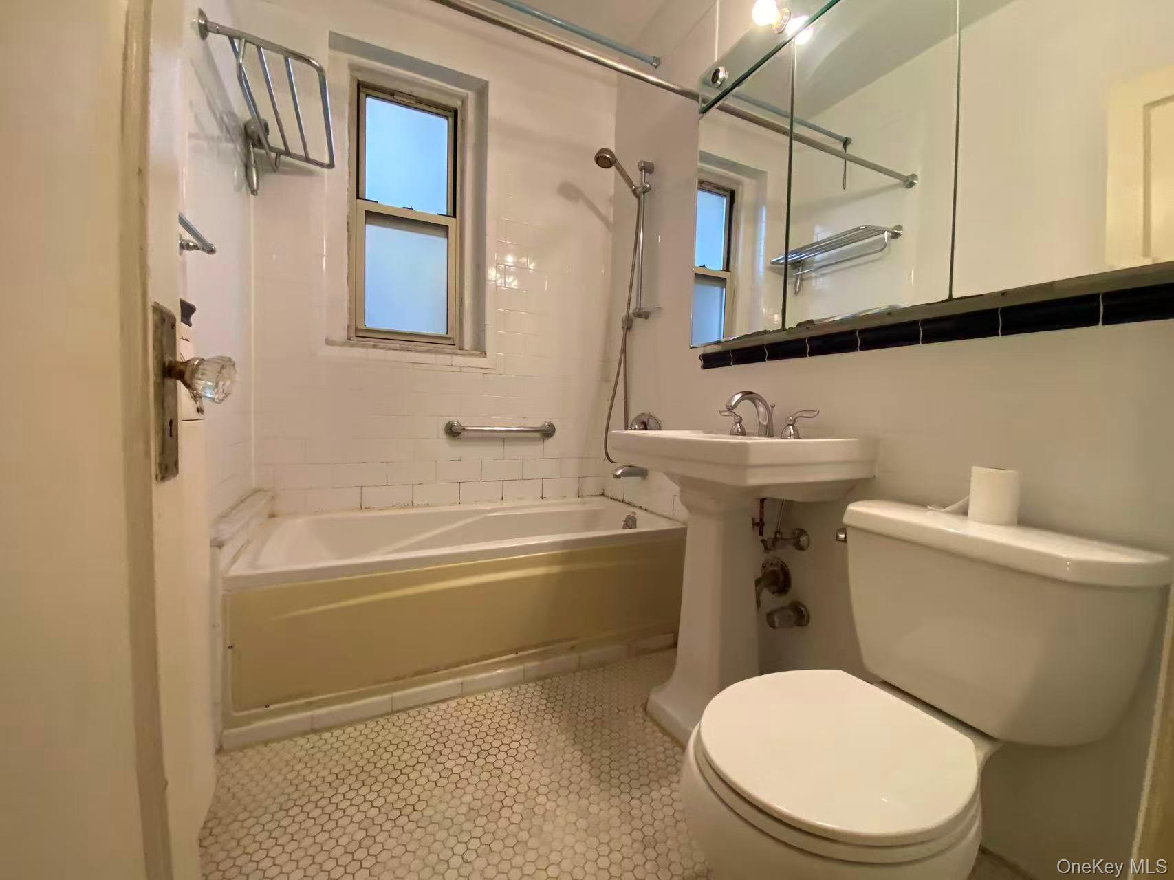 79-15 35th Avenue, Unit 3C Queens, NY 11372 - Photo 8 of 13 Bathroom featuring shower / tub combination, plenty of natural light, and tile patterned floors