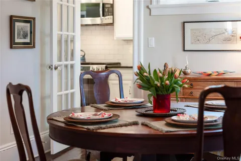 a kitchen with granite countertop a refrigerator sink and cabinets