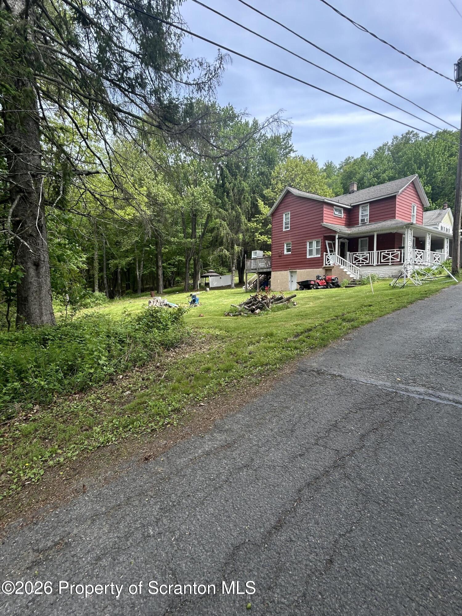 63 Shannon Street Simpson, PA 18407 - Photo 3 of 18 a front view of house with yard and green space