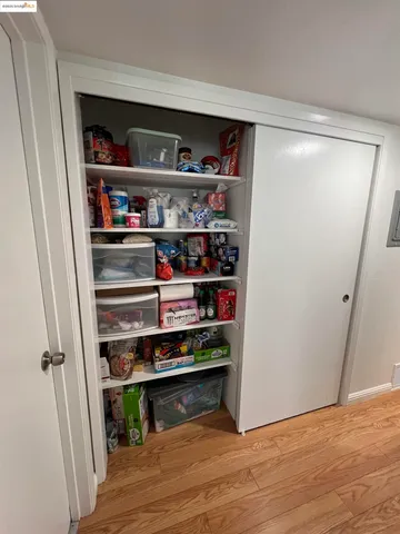 a shelf with cup and plates