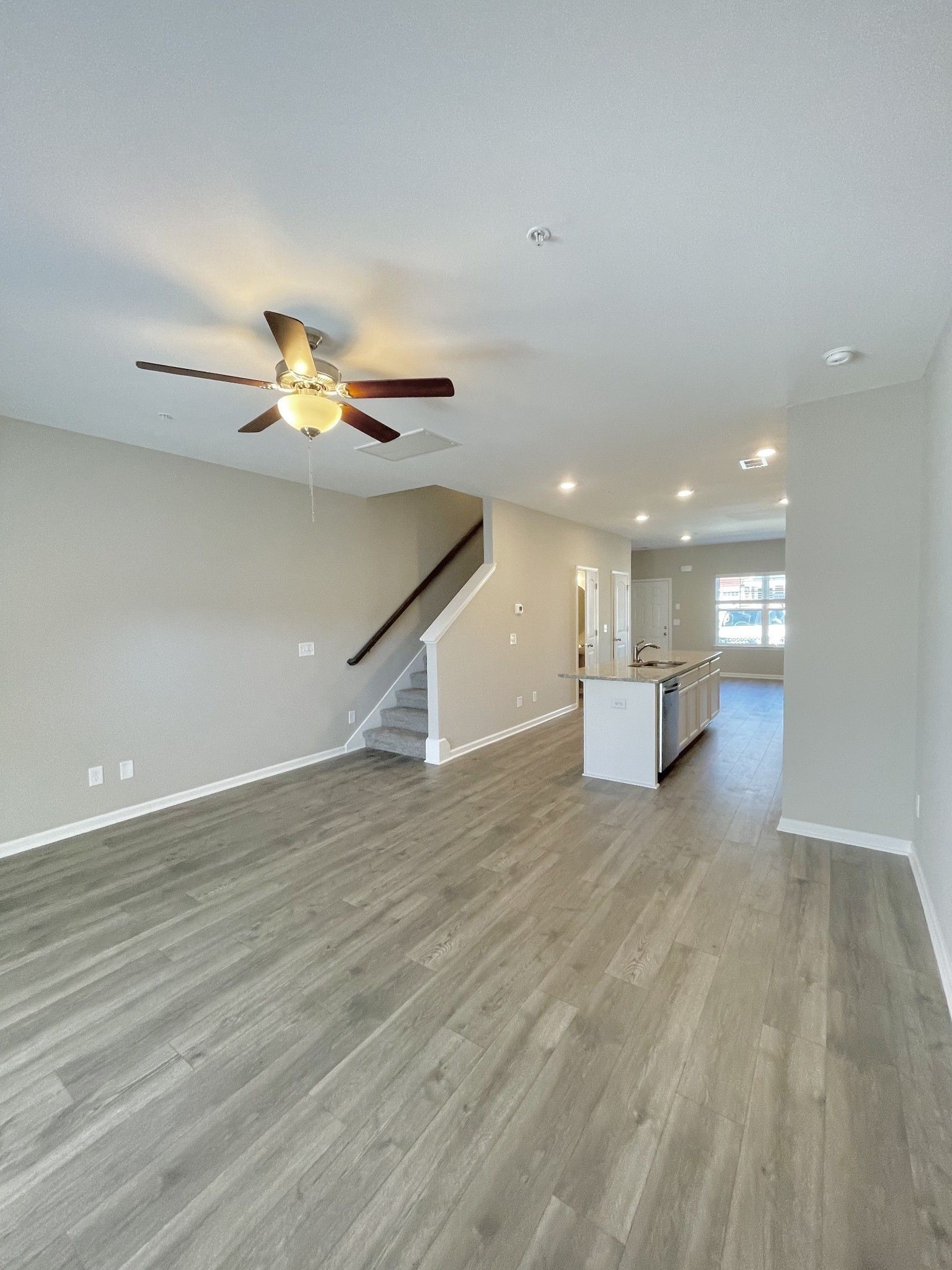 175 Addi Street Pleasant View, TN 37146 - Photo 7 of 13 a view of empty room with wooden floor and window