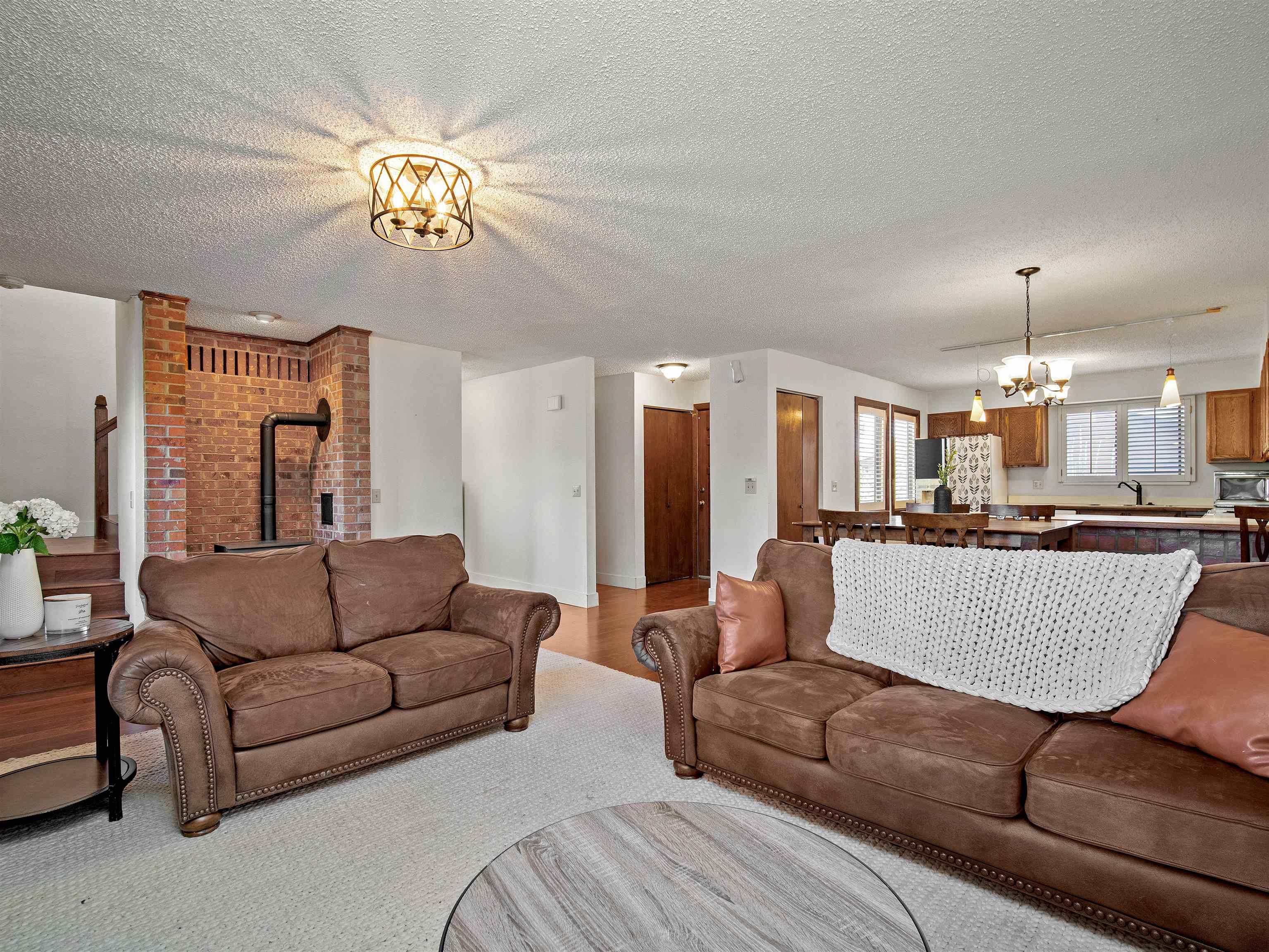 517 Rado Drive, Unit D Grand Junction, CO 81507 - Photo 10 of 24 a living room with furniture and a chandelier