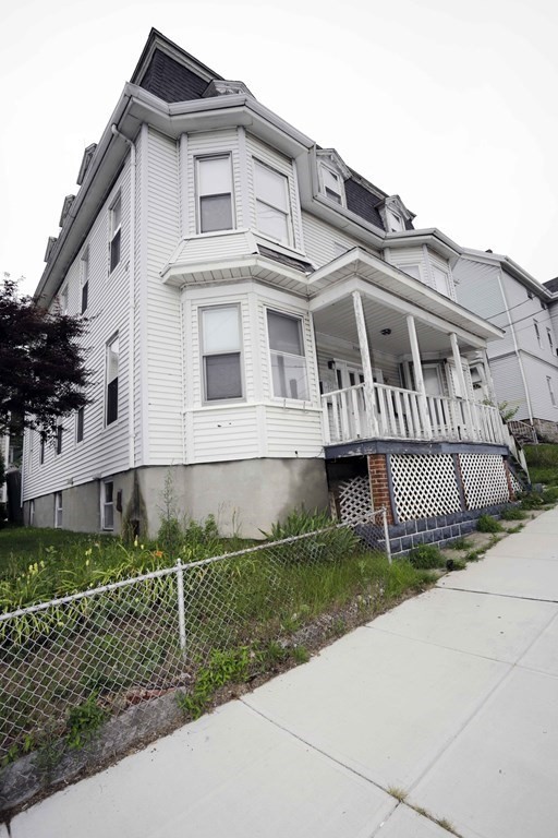 934 Middle Street Fall River, MA 02721 - Photo 1 of 30 front view of a house with a small yard