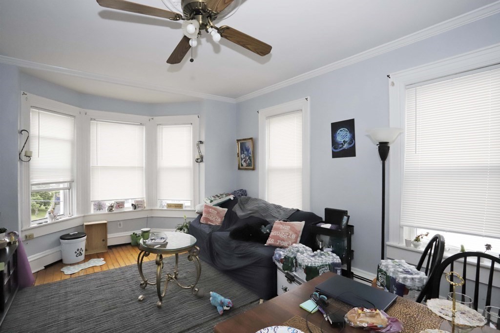 934 Middle Street Fall River, MA 02721 - Photo 12 of 30 a living room with furniture or window and a chandelier