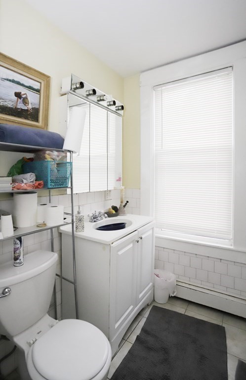 934 Middle Street Fall River, MA 02721 - Photo 14 of 30 a bathroom with a sink toilet and window