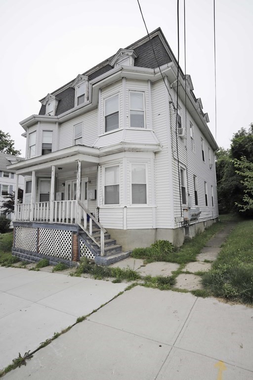 934 Middle Street Fall River, MA 02721 - Photo 2 of 30 a front view of a house with a garden