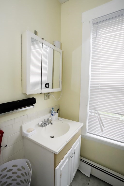 934 Middle Street Fall River, MA 02721 - Photo 21 of 30 a bathroom with a sink and a mirror