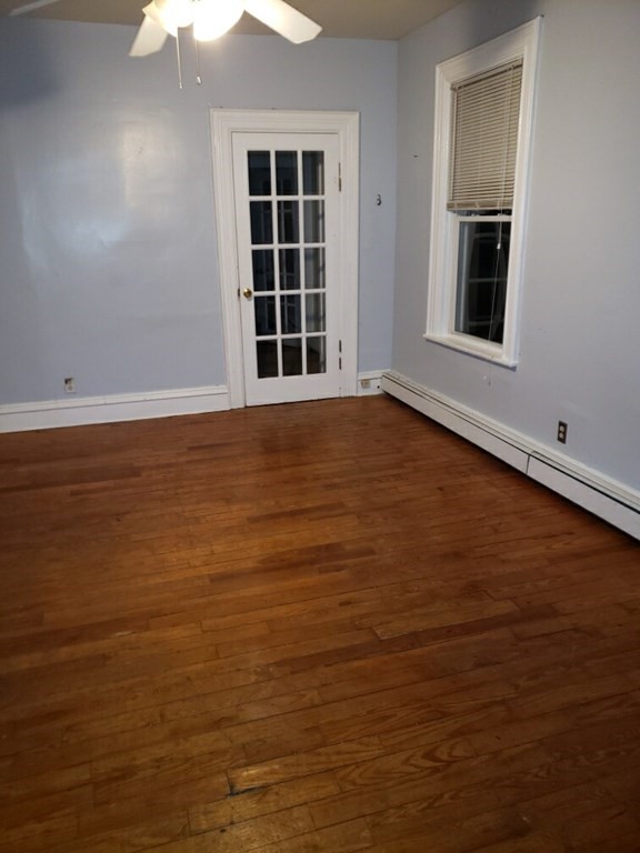 934 Middle Street Fall River, MA 02721 - Photo 28 of 30 a view of an empty room with wooden floor and a window