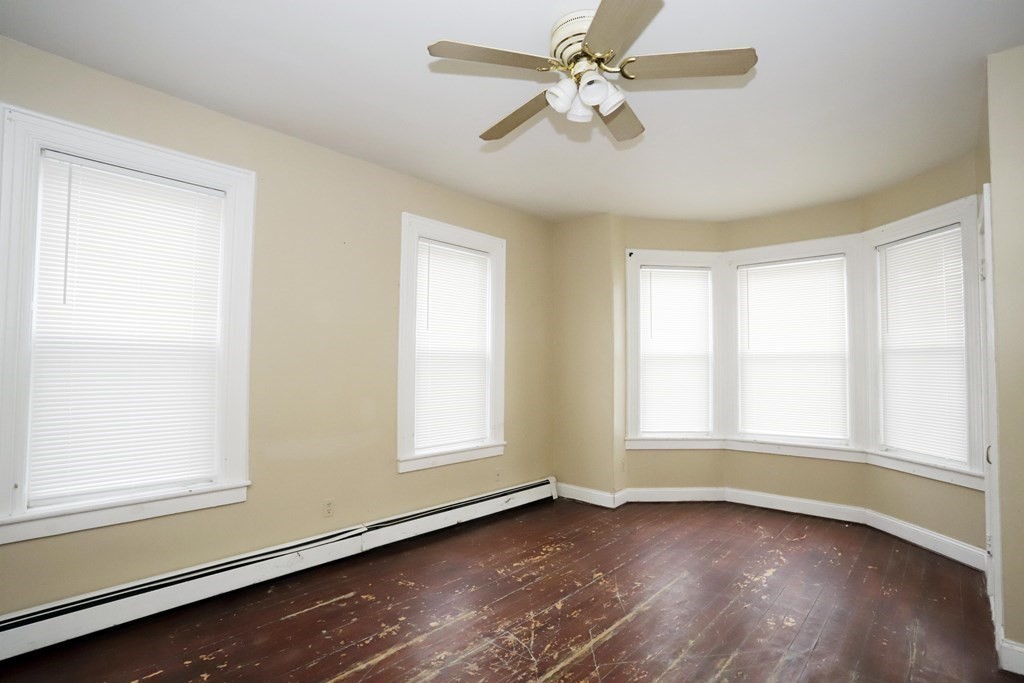 934 Middle Street Fall River, MA 02721 - Photo 3 of 30 wooden floor in an empty room with a window