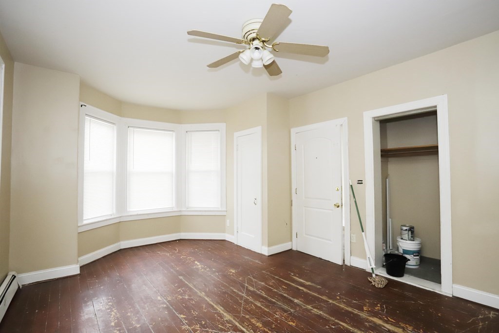 934 Middle Street Fall River, MA 02721 - Photo 4 of 30 wooden floor in an empty room with a window