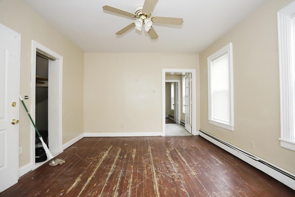 934 Middle Street Fall River, MA 02721 - Photo 5 of 30 wooden floor in an empty room with a window