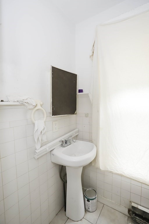 934 Middle Street Fall River, MA 02721 - Photo 9 of 30 a bathroom with a sink toilet and mirror