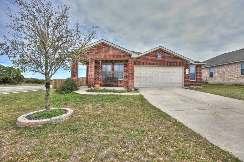 a front view of a house with a yard