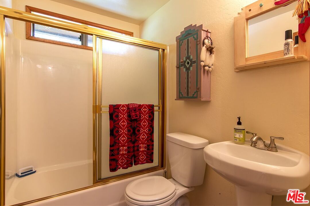 25335 Foster Road Idyllwild, CA 92549 - Photo 22 of 23 a bathroom with a sink a toilet and shower