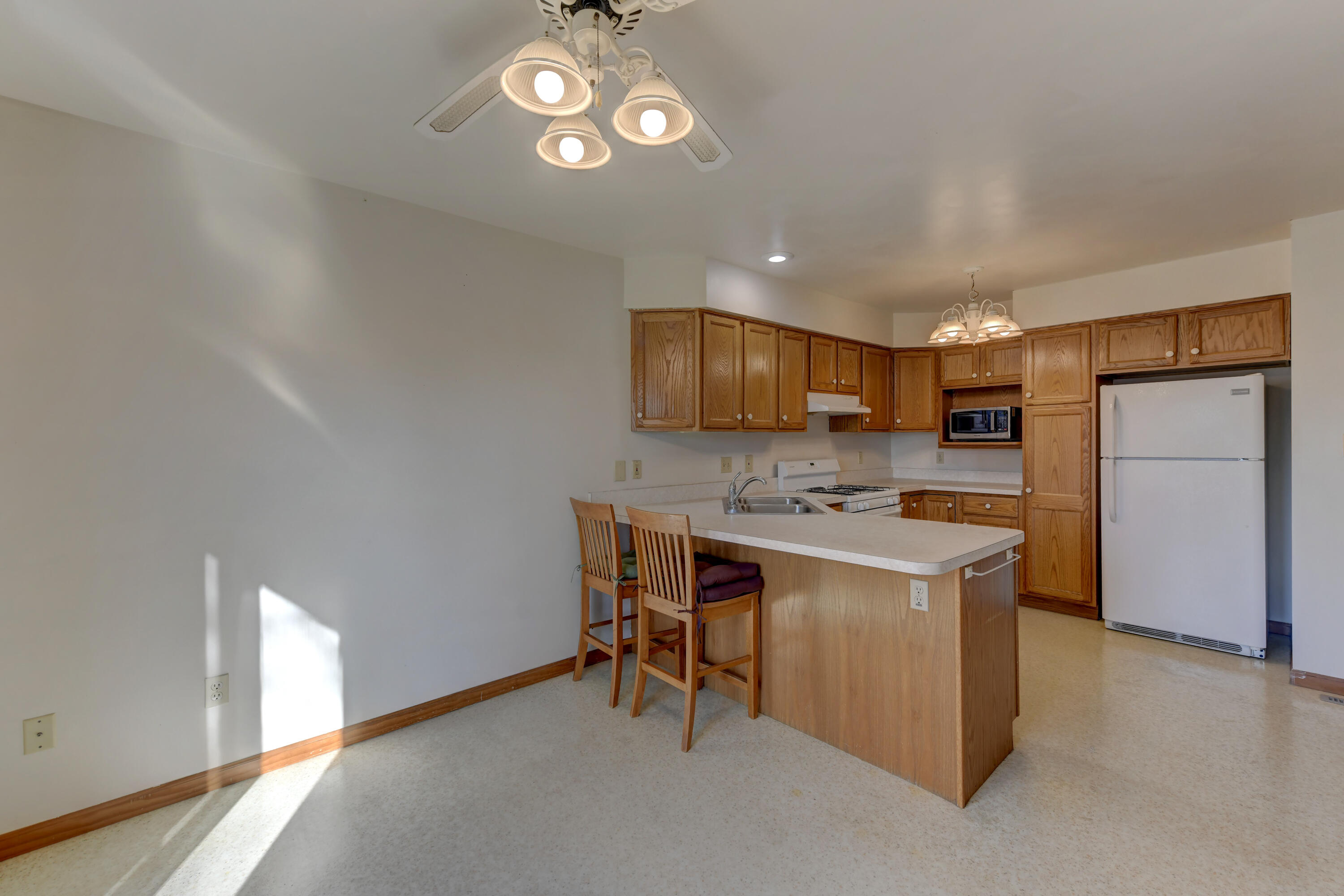 2626 41st Place Highland, IN 46322 - Photo 20 of 24 a view of a kitchen with a sink and a refrigerator