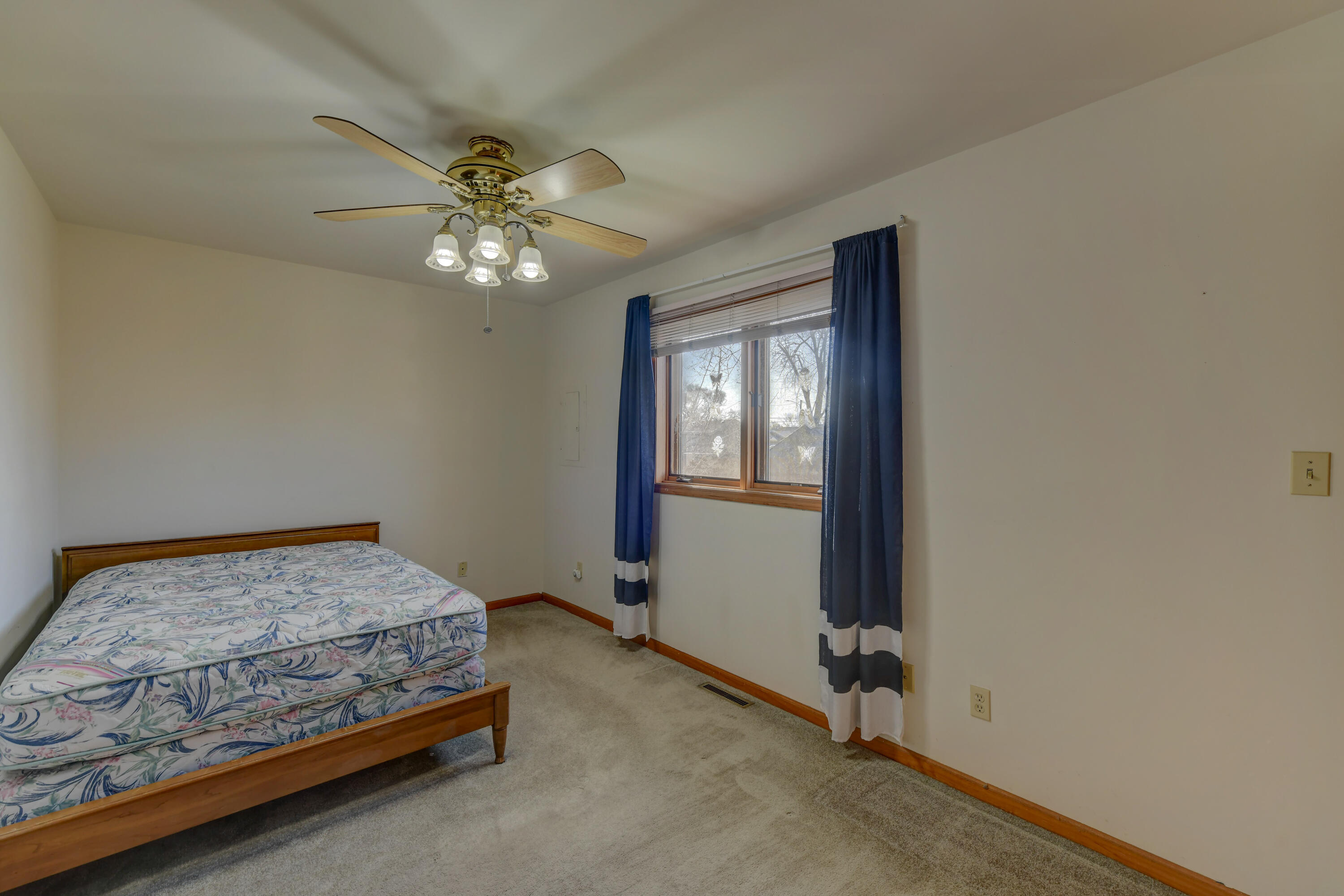 2626 41st Place Highland, IN 46322 - Photo 24 of 24 a bedroom with a bed and a chandelier