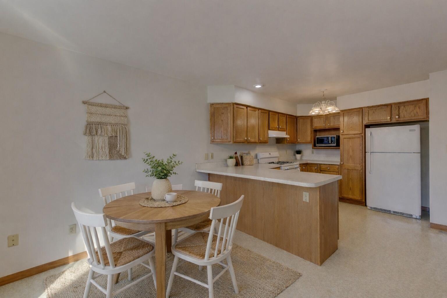 2626 41st Place Highland, IN 46322 - Photo 10 of 24 a kitchen with a table and chairs in it