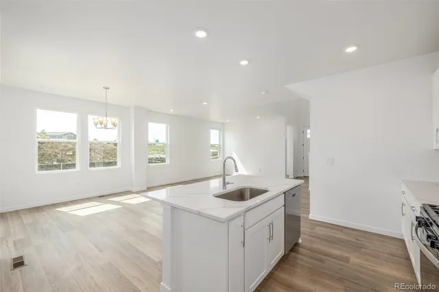 a kitchen with sink and window