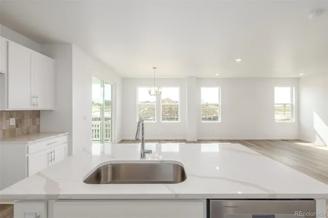 a kitchen with sink and window