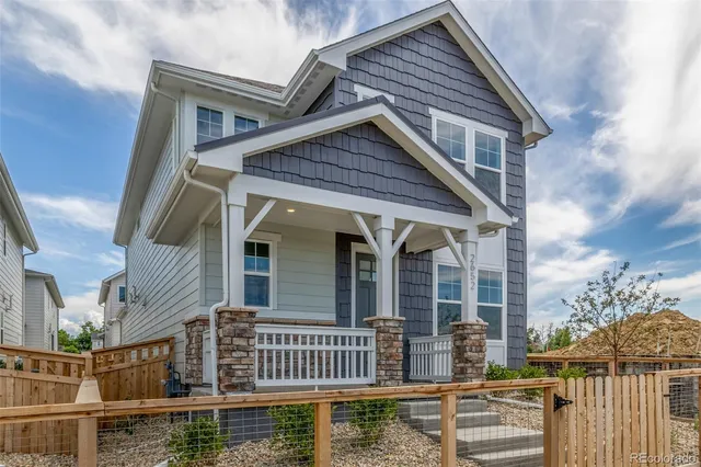 front view of a house with a small yard