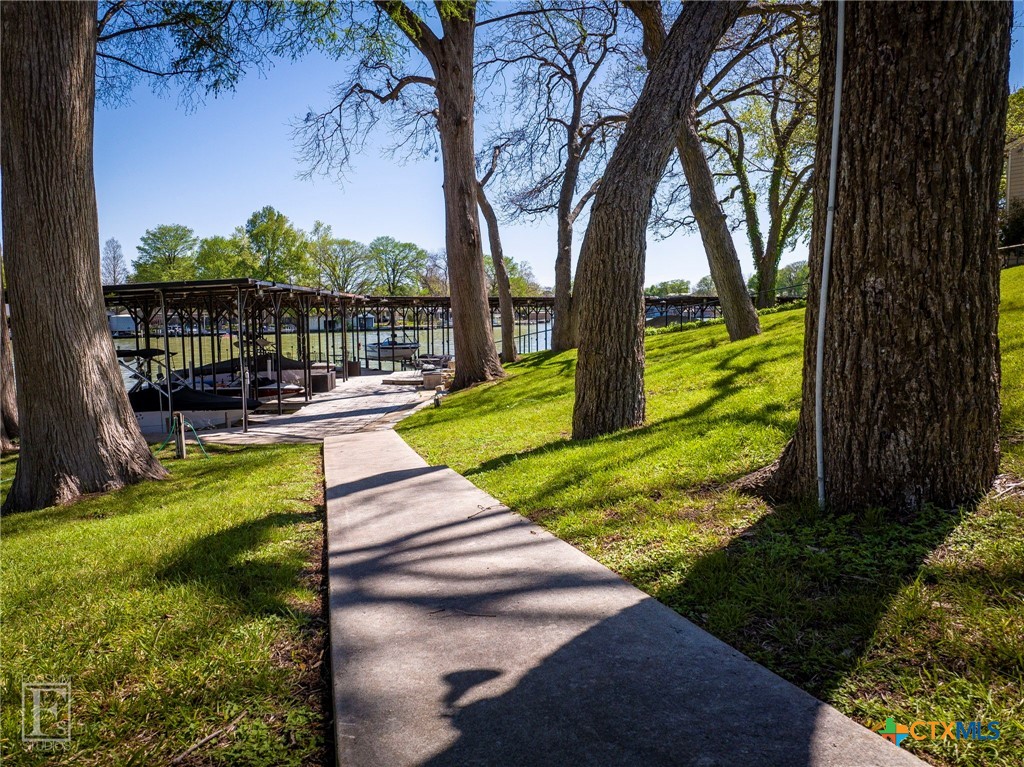 551 Terminal Loop Road, Unit B3 McQueeney, TX 78123 - Photo 13 of 13 a view of a swimming pool with a patio and a yard