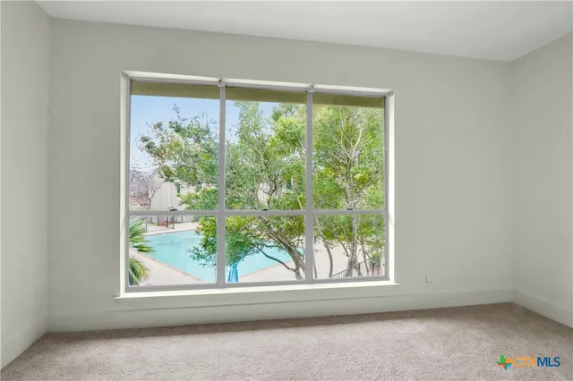 a view of a room with a large window