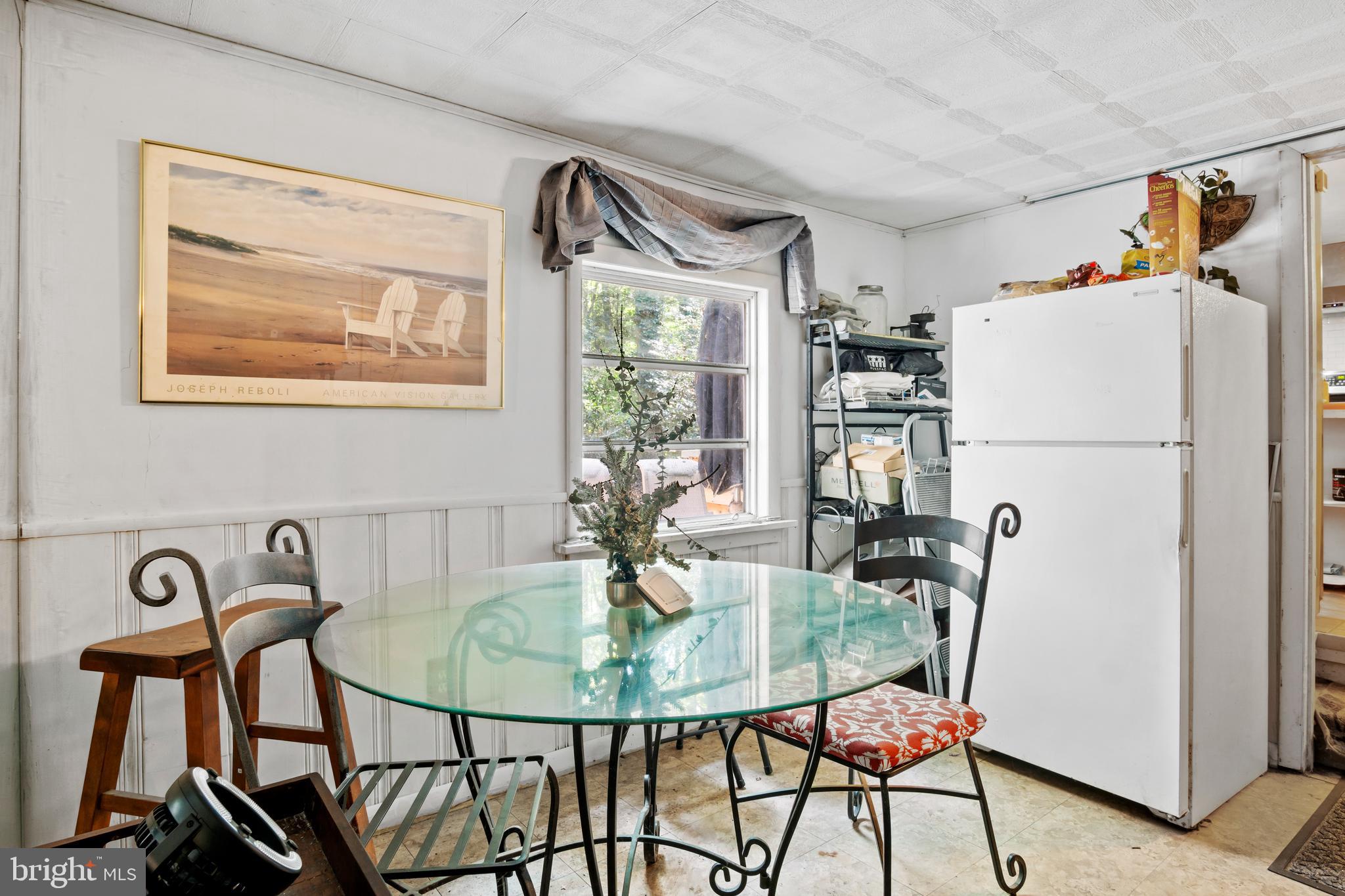 13640 Collins Pond Road East Georgetown, DE 19947 - Photo 16 of 41 a dining room with furniture and window