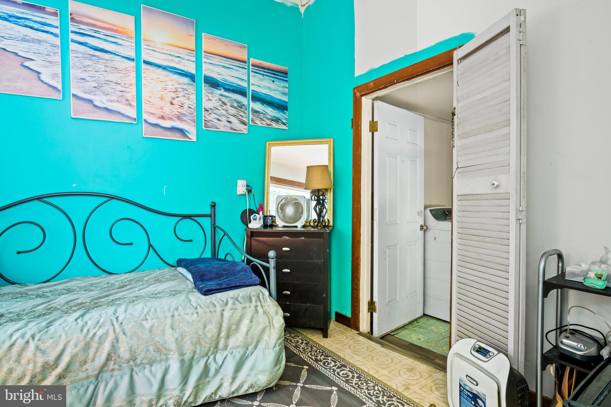13640 Collins Pond Road East Georgetown, DE 19947 - Photo 24 of 41 a bedroom with a bed and a window