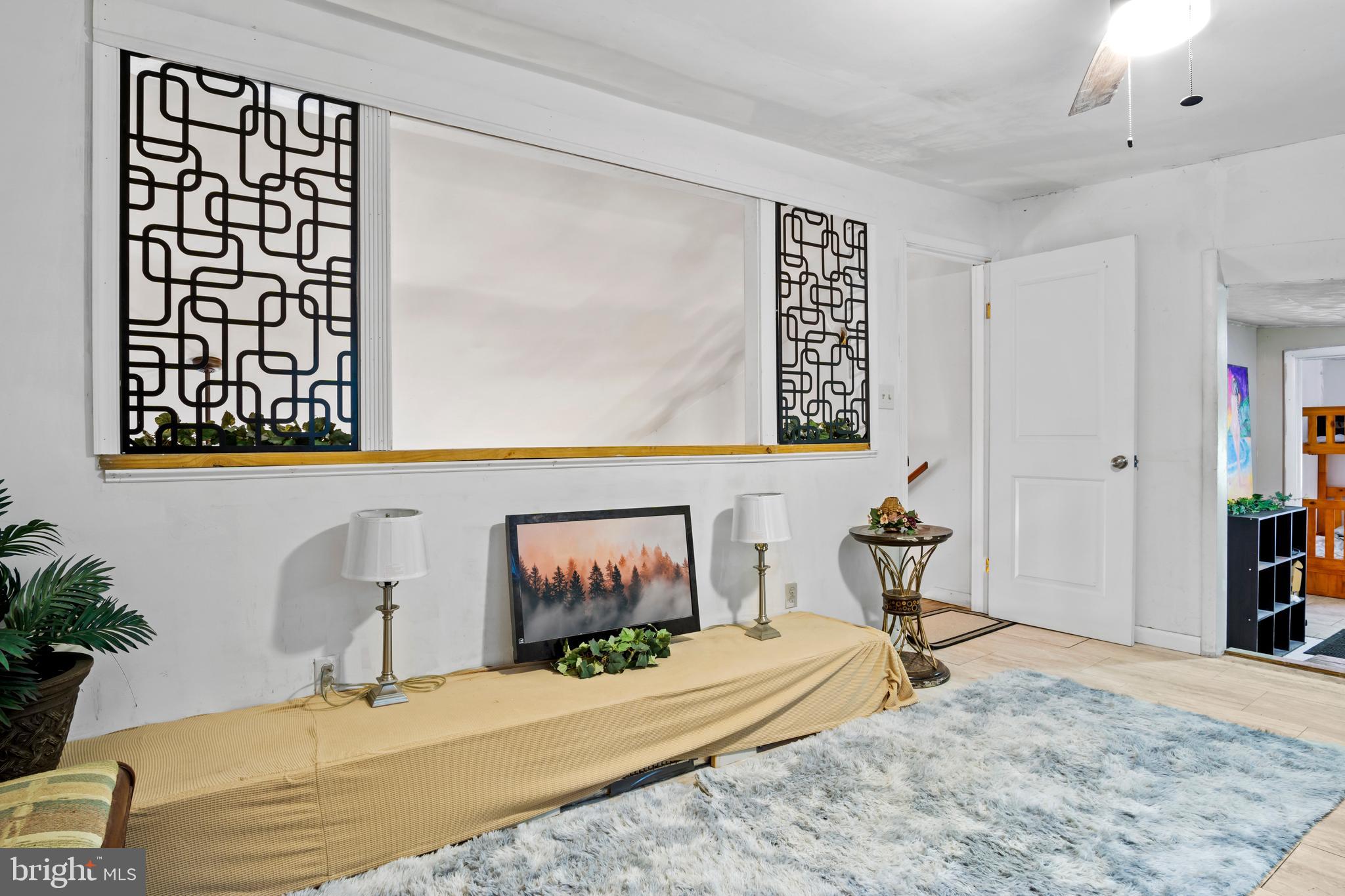 13640 Collins Pond Road East Georgetown, DE 19947 - Photo 31 of 41 a bedroom with a bed and a window