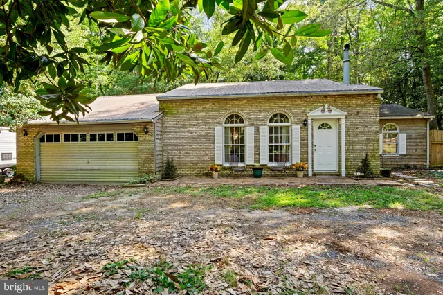a house view with a backyard space