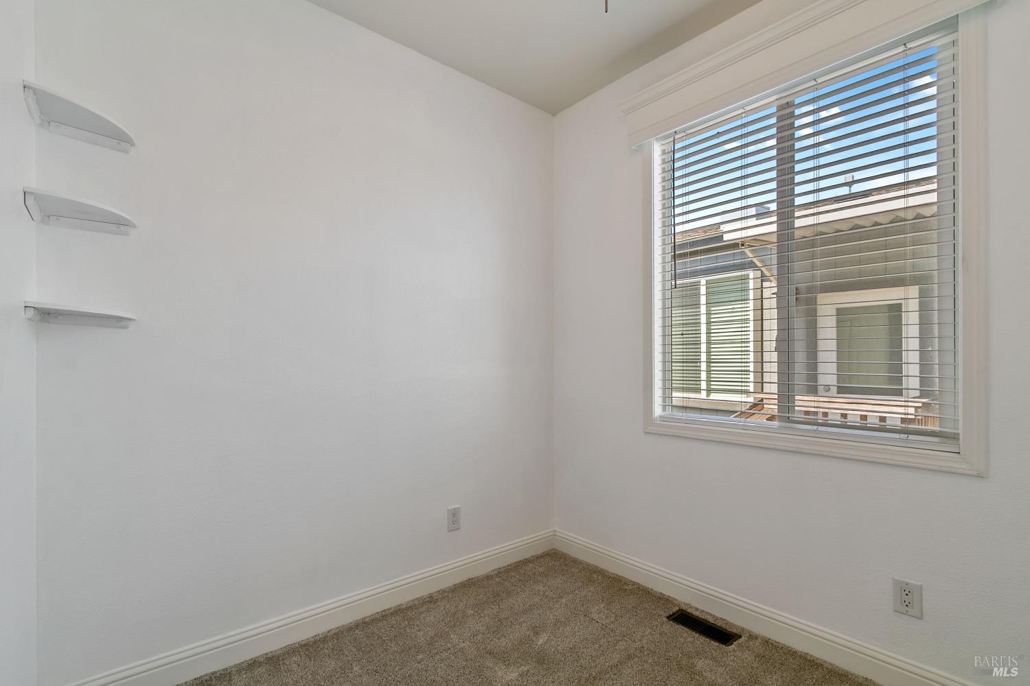 1161 Benicia Road, Unit 18 Vallejo, CA 94591 - Photo 14 of 16 an empty room with a window