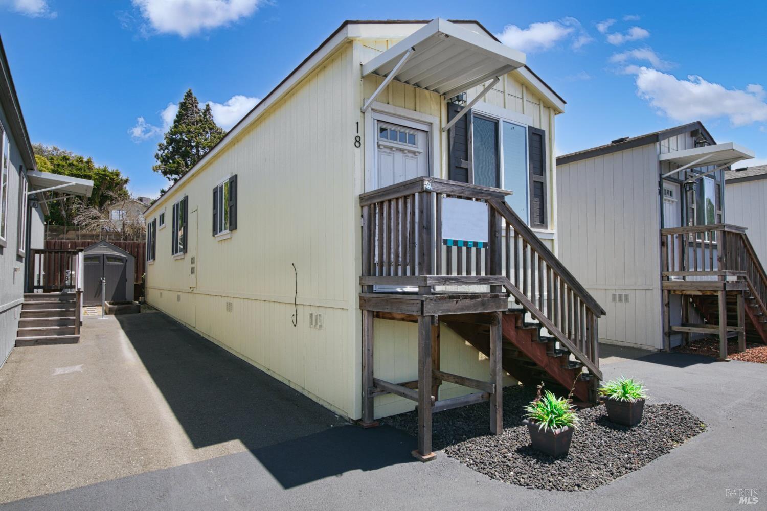1161 Benicia Road, Unit 18 Vallejo, CA 94591 - Photo 3 of 16 a front view of house along with deck and outdoor seating
