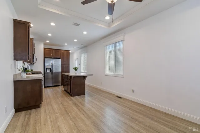 a kitchen with a refrigerator and a sink